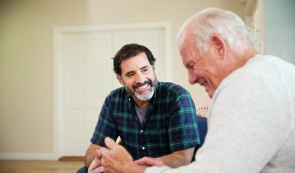 man sitting with father