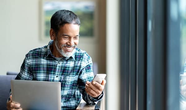 man looking at phone